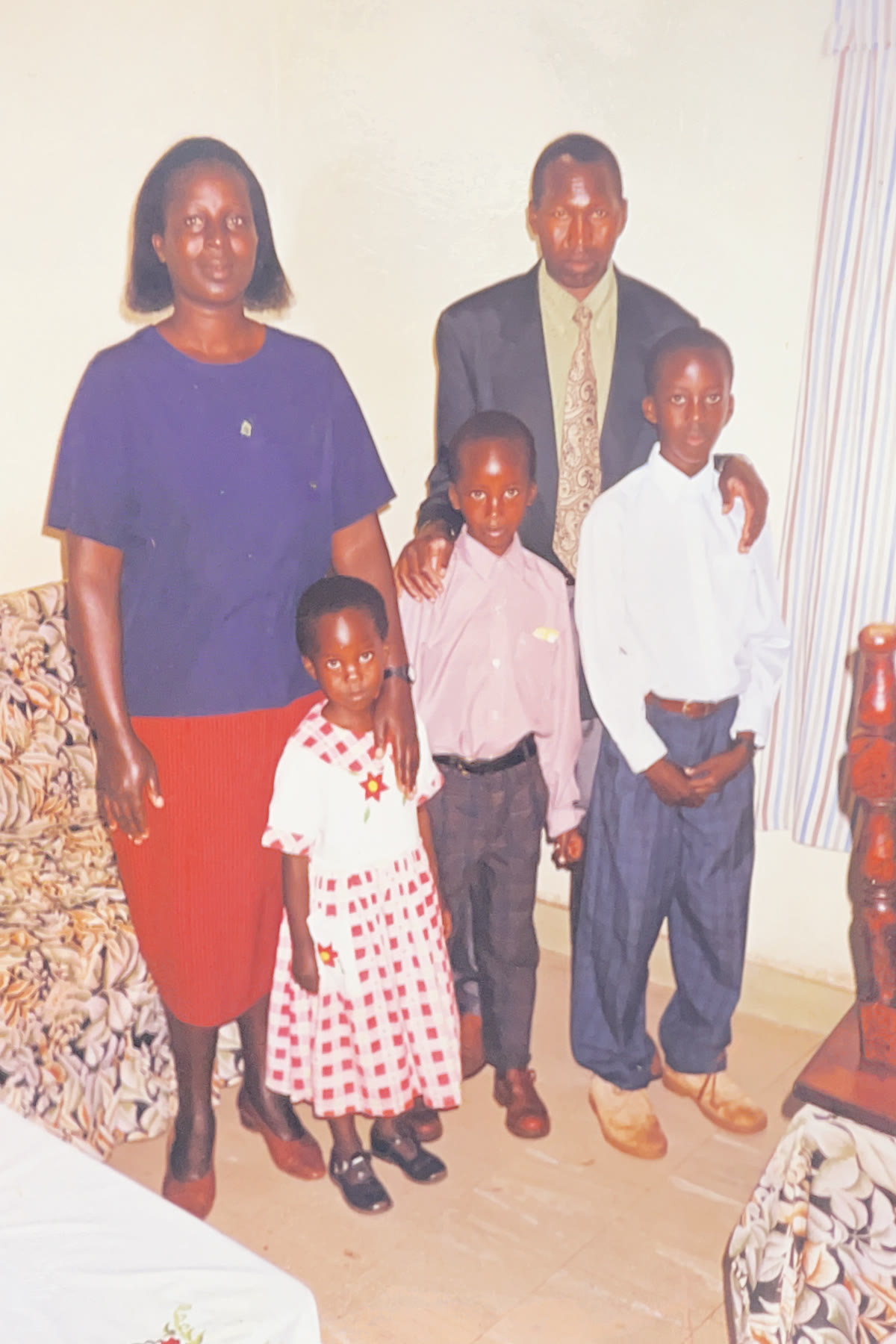 Andrew and four family members posing together indoors.