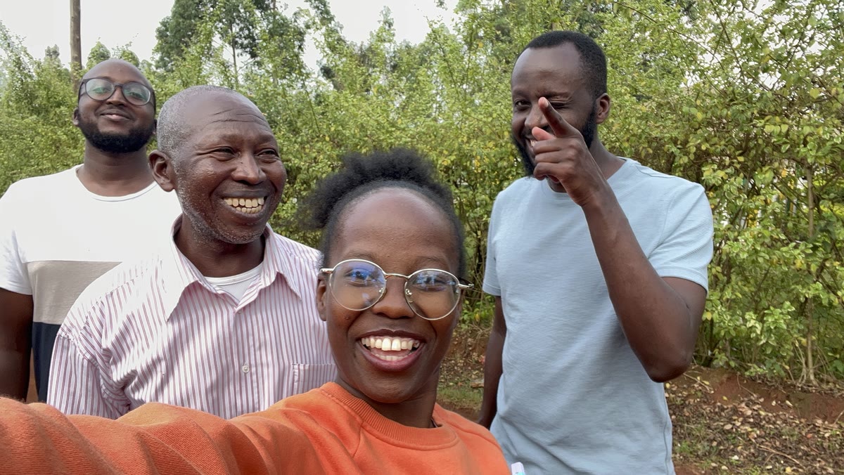 Andrew smiling with three other people in an outdoor selfie.